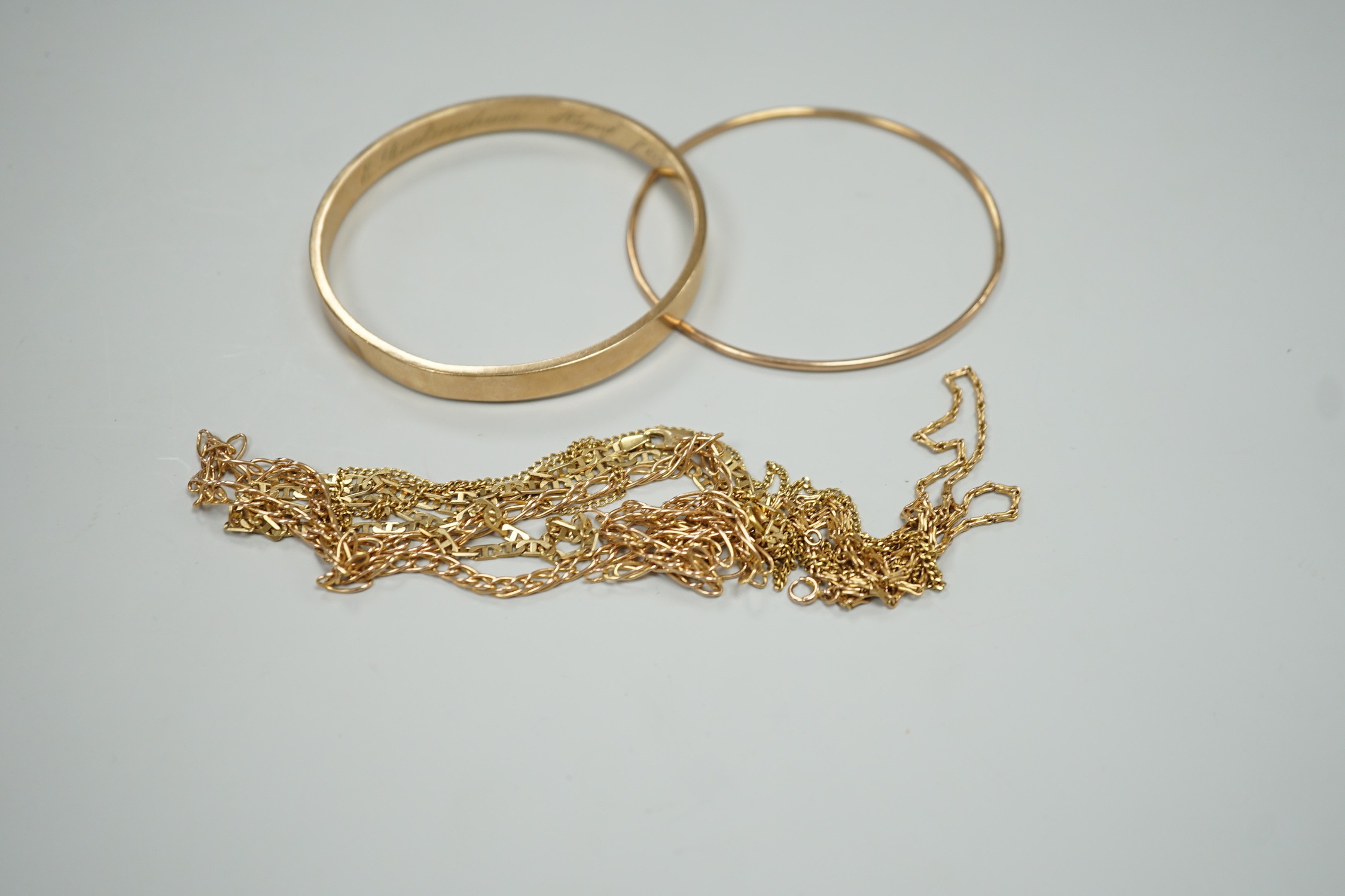 Two 9ct gold bangles and four modern 9ct gold chains, one a.f. gross 42.8 grams.